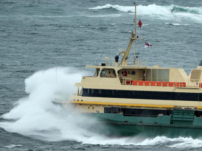 The Freshwater smashes through the heavy swell across the Heads on Wednesday. Picture: Tim Hunter.