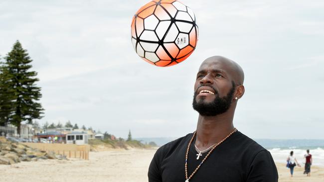 One of Adelaide United's true characters Gyawe Jonas Salley has returned to Adelaide - where he lives - briefly before returning to China. Jonas has a walk along the beach at Henley Beach.