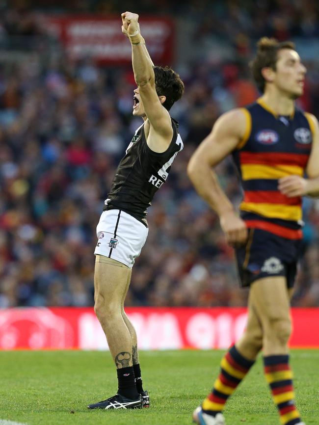 Victory salute: Chad Wingard celebrates kicking the goal that put Port in front with seconds to go. Picture: Sarah Reed