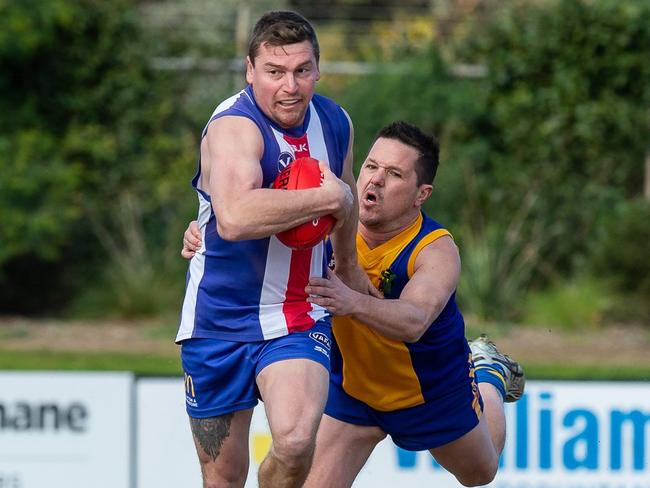 Shane Borland attempts to break a Cory Wilson tackle. (VAFA)