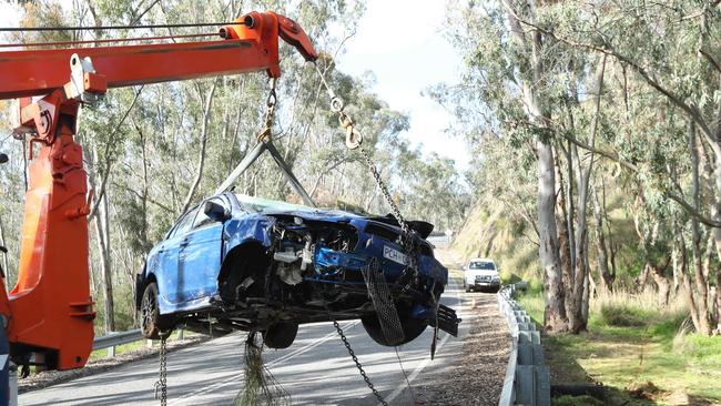 A car is removed after falling 30m down a cliff at Paracombe. Picture: Tait Schmaal.