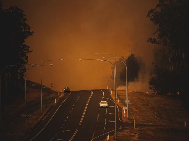 Pictured is the bushfire behind surf beach and sunshine bay on George Bass Drive at Batemans Bay. Picture: Josh Burkinshaw