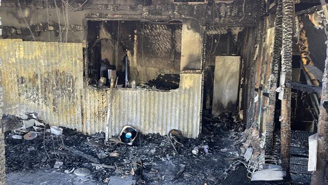 The remains at the back of the Kent family home after the Sunday night fire.