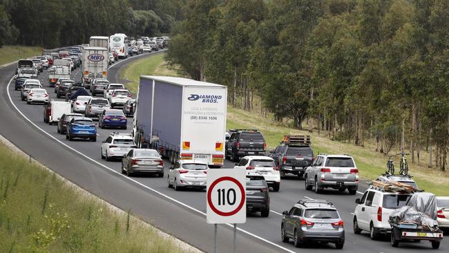 Slow holiday traffic leaving Sydney on the Hume Motorway near Campbelltown. Picture: Jonathan Ng