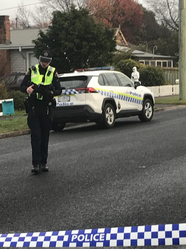 Tasmania Police crime scene investigators and officers on Main Street in Ulverstone where a woman was found dead. Photo: Helen Kempton