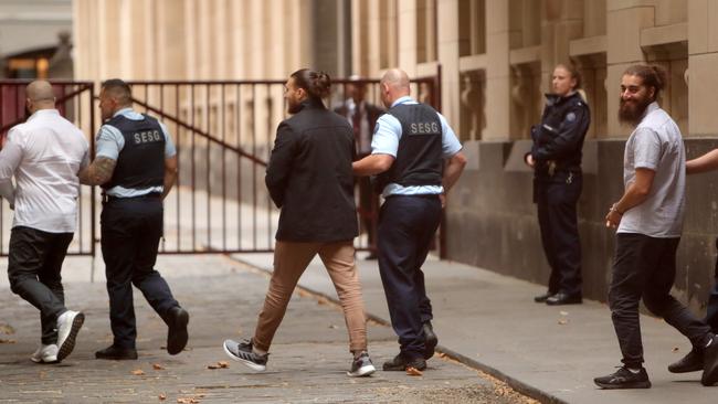 The trio leave court accused of firebombing a Shia mosque in Fawkner. Picture: Stuart McEvoy