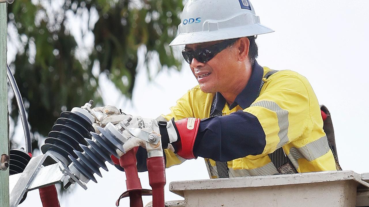 Energex workers get on with recovery efforts outside HOTA and Bundall. Picture Glenn Hampson