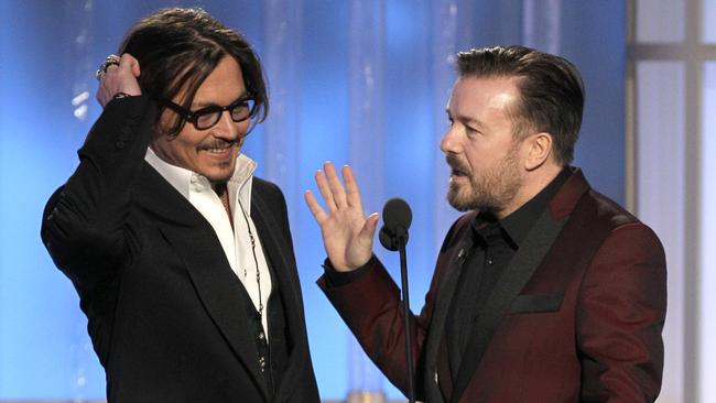 Johnny Depp and Ricky Gervais during the 69th Annual Golden Globe Awards. Picture: AP Photo/NBC, Paul Drinkwater