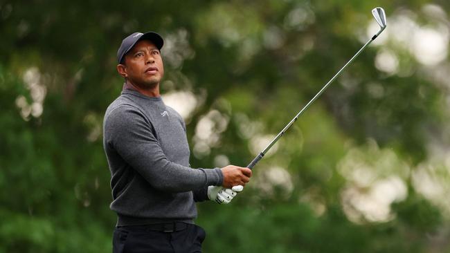 Tiger Woods of the United States plays his shot from the fourth tee during a practice round prior to the 2024 Masters Tournament.