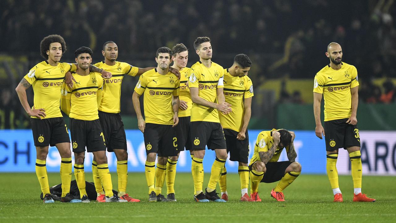 Dortmund's Paco Alcacer, 2nd from right, looks down disappointed after he missed to score the first penalty