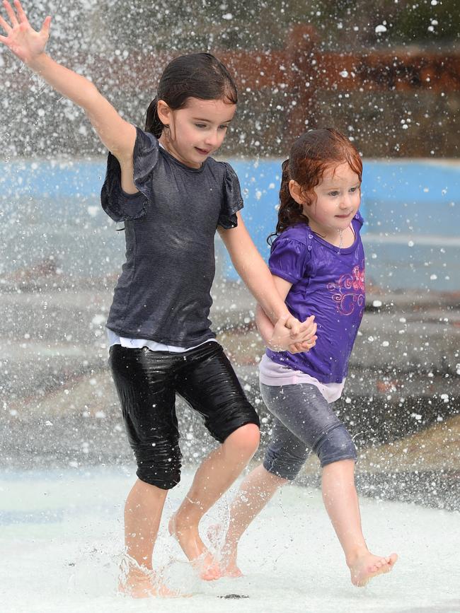 Sisters Elizabeth and Olivia have fun playing at the water park in Seville. Picture: Lawrence Pinder