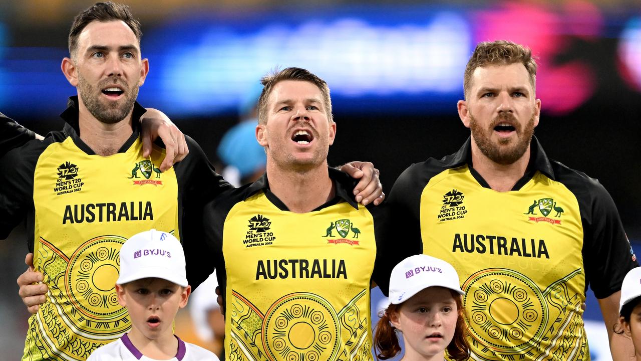 Glenn Maxwell, David Warner and Aaron Finch embrace for their national anthem before the T20 World Cup match between Australia and Ireland at the Gabba. Picture: Getty Images