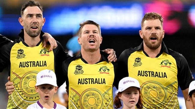 Glenn Maxwell, David Warner and Aaron Finch embrace for their national anthem before the T20 World Cup match between Australia and Ireland at the Gabba. Picture: Getty Images