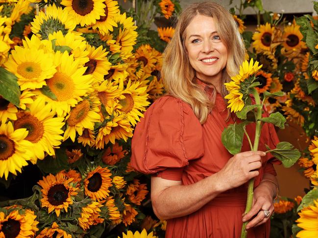 Florist Saskia Havekes at her Potts Point shop with Sunflowers. Picture: Tim Hunter.