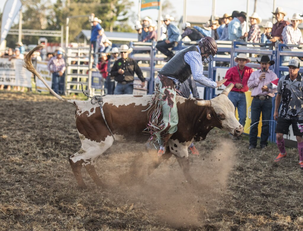 Brendan Kelly kicks up the dust in the Junior Bullride at the Maclean Twilight Rodeo. Picture: Adam Hourigan