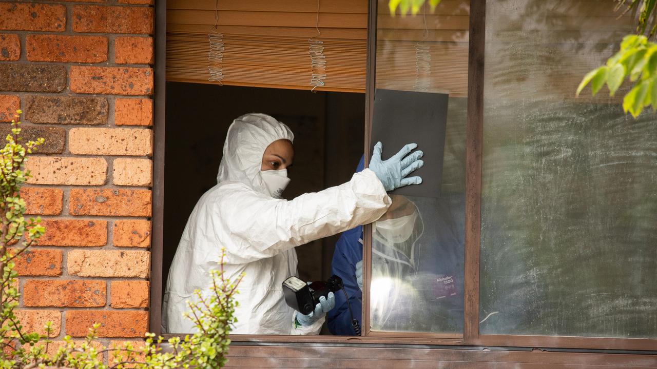 Specialist police were seen checking a window at the house for prints on Sunday. Picture: NCA NewsWire / David Swift