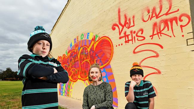 Westport Primary School deputy principal Angela Ratcliffe with students Nell and Tully. They are devastated their artwork was ruined by a mocking message over the weekend. Picture: Tom Huntley