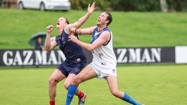 Old Melburnians’ Jack Spargo battling with University Blues skipper Ayce Cordy in the ruck in Round 1. Picture: George Sal