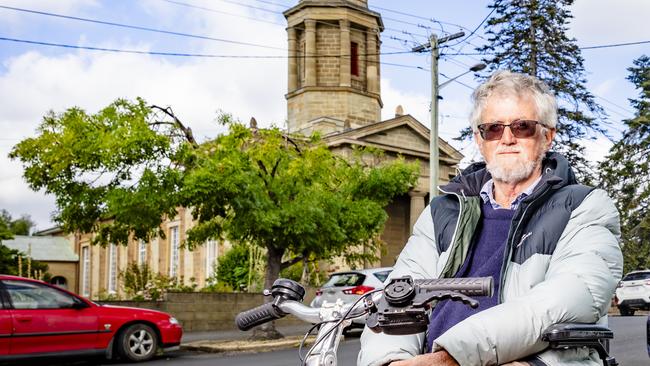 Battery Point resident Ian Broinowski is upset by the way in which trees have been cut back by Tas Networks. Picture: Linda Higginson