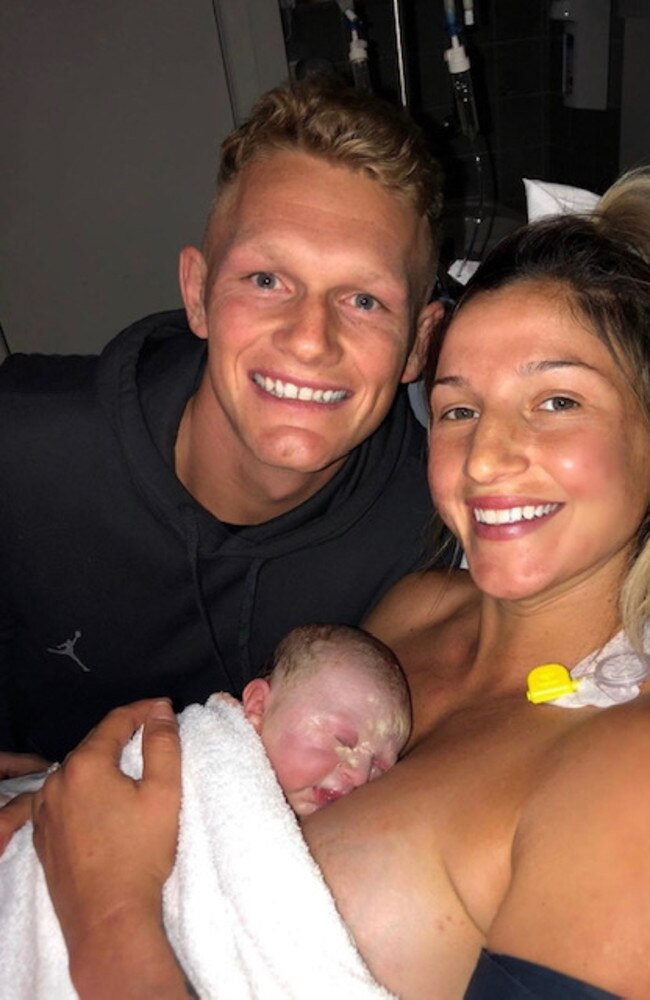 Adam Treloar and Kim Ravaillion with their newborn Georgie. Picture: Instagram