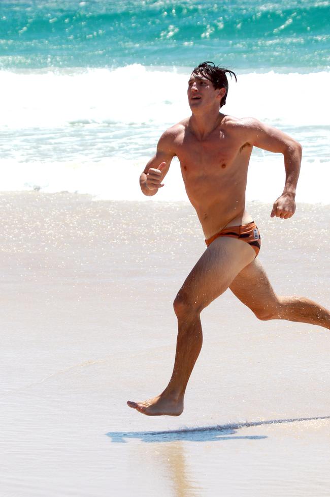 Rhys King running out of the water during the Southport Sharks VFL team during a preseason training camp at Tallebudgera Beach. Picture: Mike Batterham