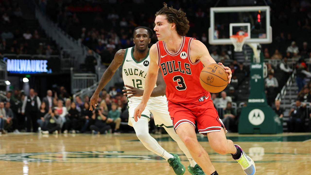 MILWAUKEE, WISCONSIN - OCTOBER 14: Josh Giddey #3 of the Chicago Bulls drives around Taurean Prince #12 of the Milwaukee Bucks during the first half of a pre-season game at Fiserv Forum on October 14, 2024 in Milwaukee, Wisconsin. NOTE TO USER: User expressly acknowledges and agrees that, by downloading and or using this photograph, User is consenting to the terms and conditions of the Getty Images License Agreement. Stacy Revere/Getty Images/AFP (Photo by Stacy Revere / GETTY IMAGES NORTH AMERICA / Getty Images via AFP)