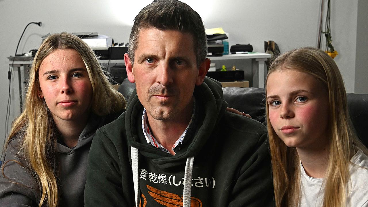 Lee Lovell and his daughters Scarlett and Kassie at their home in North Lakes. Picture: Lyndon Mechielsen/Courier Mail