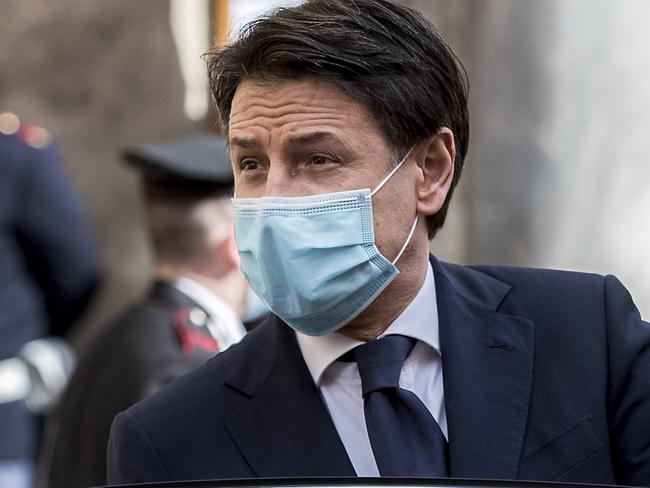 Italian Premier Giuseppe Conte leaves after addressing the Senate, in Rome. Picture: AP.