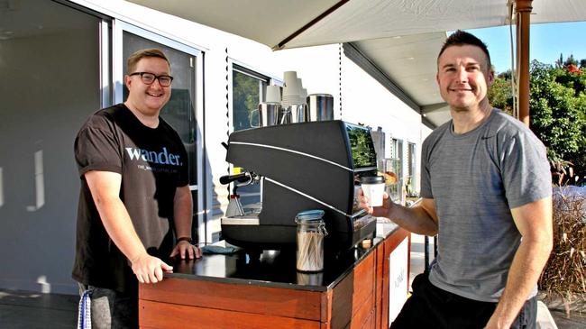 COOL CART: Wander Coffee Cart founder Ryan Ferguson at his morning pitch at the Goonellabah Business Hub with happy customer and landord David Russell. Picture: Alison Paterson