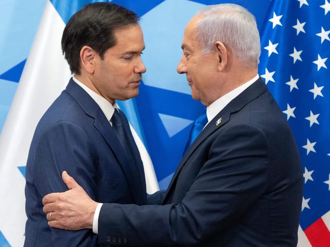 US Secretary of State Marco Rubio (L) and Israeli Prime Minister Benjamin Netanyahu greet each other during a joint press conference at the prime minister's office in Jerusalem on February 16, 2025. Rubio said on February 16 that the United States and Israel expect the Lebanese state to work towards disarming Lebanese armed group Hezbollah, which fought a deadly war with Israel last year. (Photo by Ohad Zwigenberg / POOL / AFP)