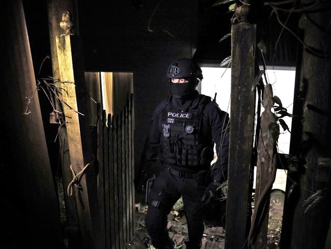 Police officers and Raptor Squad members raid a house in Ourimbah on the Central Coast. Picture: NewsCorp