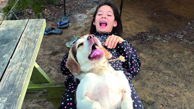 Angie playing with Dogo in Kentucky. Picture: Claudia Scath-Johnson