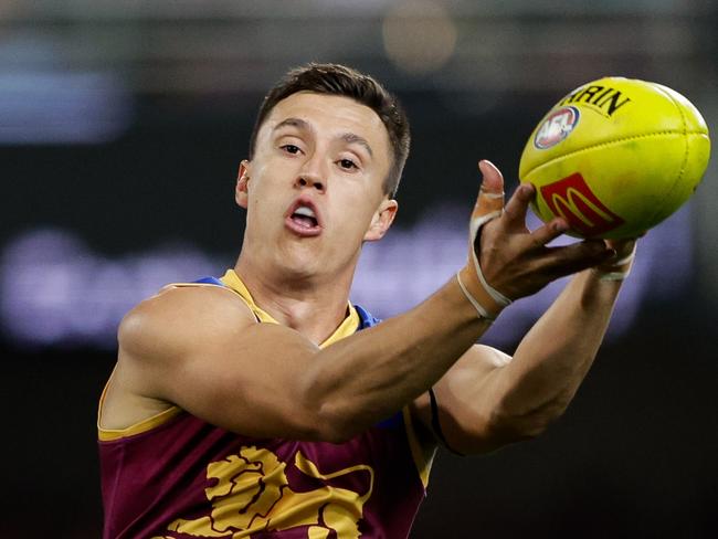 BRISBANE, AUSTRALIA - JUNE 28: Hugh McCluggage of the Lions marks the ball during the 2024 AFL Round 16 match between the Brisbane Lions and the Melbourne Demons at The Gabba on June 28, 2024 in Brisbane, Australia. (Photo by Russell Freeman/AFL Photos via Getty Images)