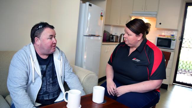 Shane with Department of Family and Community Services client services officer Yana Piper in his Riverwood flat. Picture: Angelo Velardo