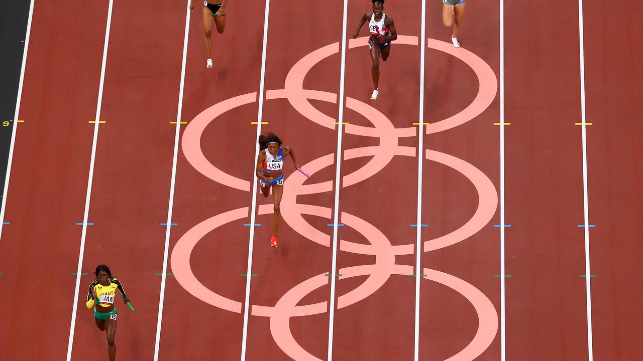 Athletes compete in the women’s 4x100m relay final at the Tokyo Olympics. (Photo by Richard Heathcote/Getty Images)