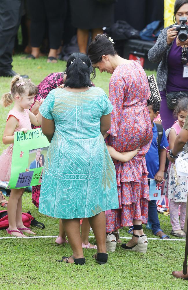 A young fan goes in for a massive cuddle. Picture: Matrix