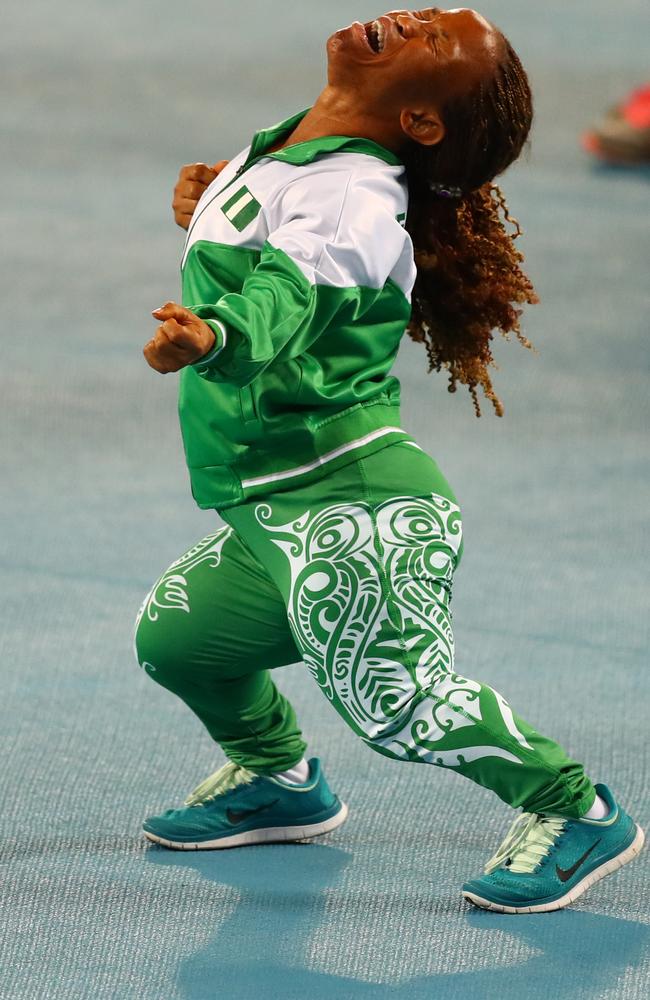 Lauritta Onye of Nigeria celebrates after breaking the world record in the women's shot put final.