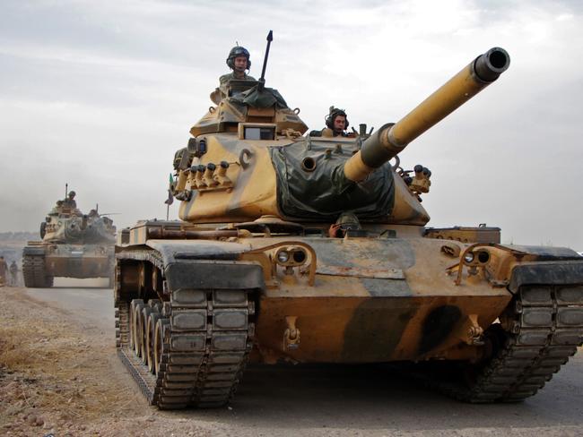 Turkish soldiers in US-made tanks drive through the town of Tukhar, north of Syria's northern city of Manbij. Picture: AFP