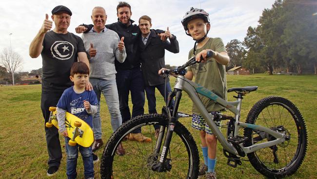 Andrew Alcorn (far left) with son Ash (second from left), Cr Roy Maggio (third from left), Ben Drayton (third from right), Kendrick Thompson (second from right), Jonny Valenta (on bike). Picture: Phil Rogers