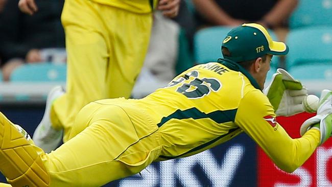 Australia's captain Tim Paine dives but fails to take the wicket of England's Jos Buttler during the first One Day International between England and Australia at The Oval cricket ground in London. Picture: AFP/ Ian Kington.