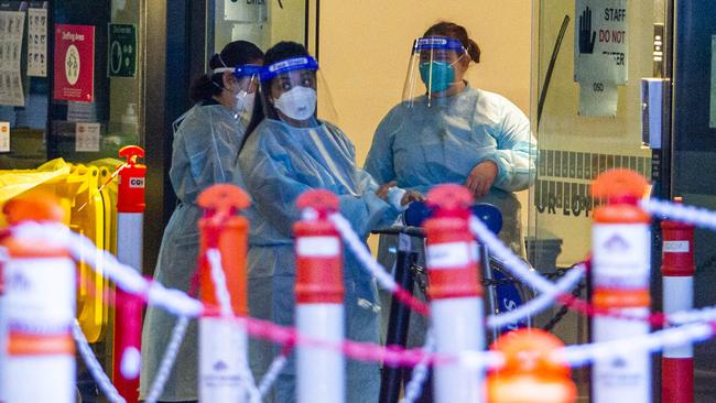 Staff at the Novotel/Ibis on 399 Londsdale St in Melbourne, which is next to a residential block where the hotel’s quarantine waste is stored. Picture: Aaron Francis