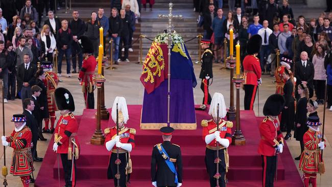 Prince William, Prince of Wales, Prince Harry, Duke of Sussex, (obscured) Princess Eugenie of York, Princess Beatrice of York, Peter Phillips, Zara Tindall, Lady Louise Windsor, James, Viscount Severn arrive to hold a vigil in honour of Queen Elizabeth II at Westminster Hall.