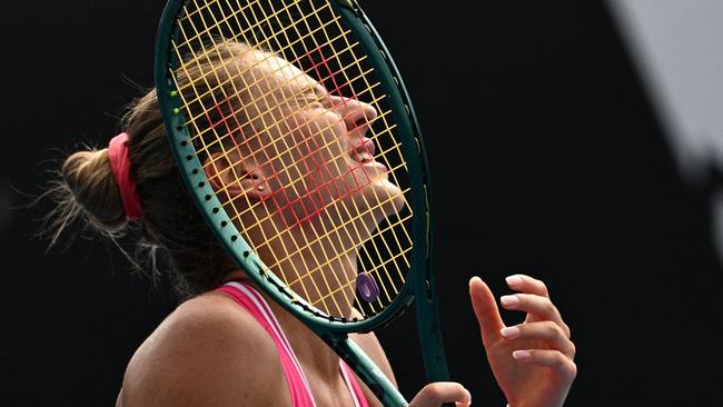 Ukraine's Marta Kostyuk reacts after a point against Russia's Elina Avanesyan during their women's singles match on day six of the Australian Open tennis tournament in Melbourne on January 19, 2024. (Photo by Anthony WALLACE / AFP) / -- IMAGE RESTRICTED TO EDITORIAL USE - STRICTLY NO COMMERCIAL USE --