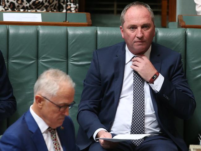 PM Malcolm Turnbull and Deputy PM Barnaby Joyce fixing his tie in Question Time at Parliament House today. Picture: Kym Smith