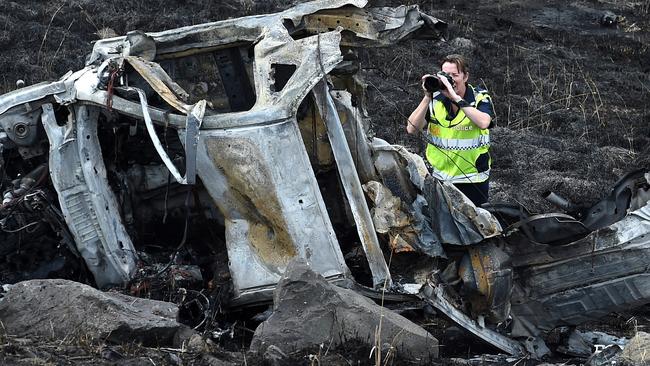 Police investigate the crash scene. Picture: Nicole Garmston