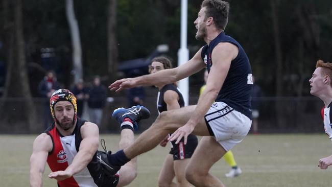 EFL Premier Division 2022: North Ringwood v Berwick at Quambee Reserve. Michael Locco (North Ringwood ) and Travis Tuck (Berwick). Picture: Valeriu Campan