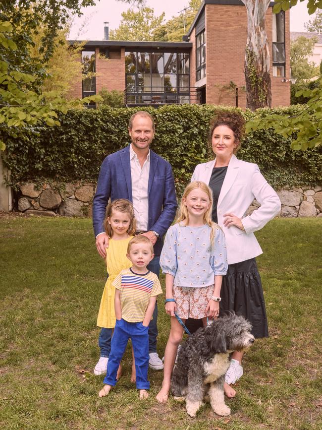 Sophie Gannon with her husband Frazer East, daughters Lucinda and Arabella and son Hubertat their home in Toorak. Picture: Josh Robenstone