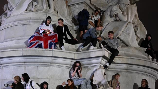 Crowds gather in front of Buckingham Palace to pay their respects following the Queen’s death. Picture: Leon Neal/Getty Images