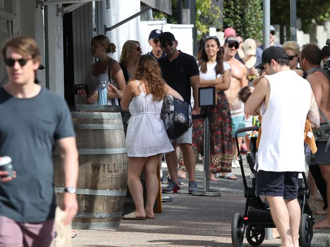 A beautiful sunny day at Balmoral Beach in Mosman has drawn crowds of people to the popular esplanade despite the warnings about the COVID-19 virus pandemic. Balmoral remains open despite eaches across the eastern suburbs and northern beaches of Sydney being closed. Picture: David Swift