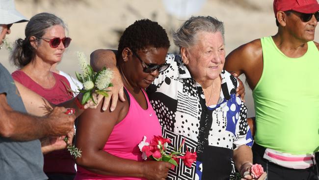 Bribie Island locals gather to pay respect to 17 year old shark attack victim Charlie Zmuda at Woorim Beach on Tuesday morning. Picture Lachie Millard